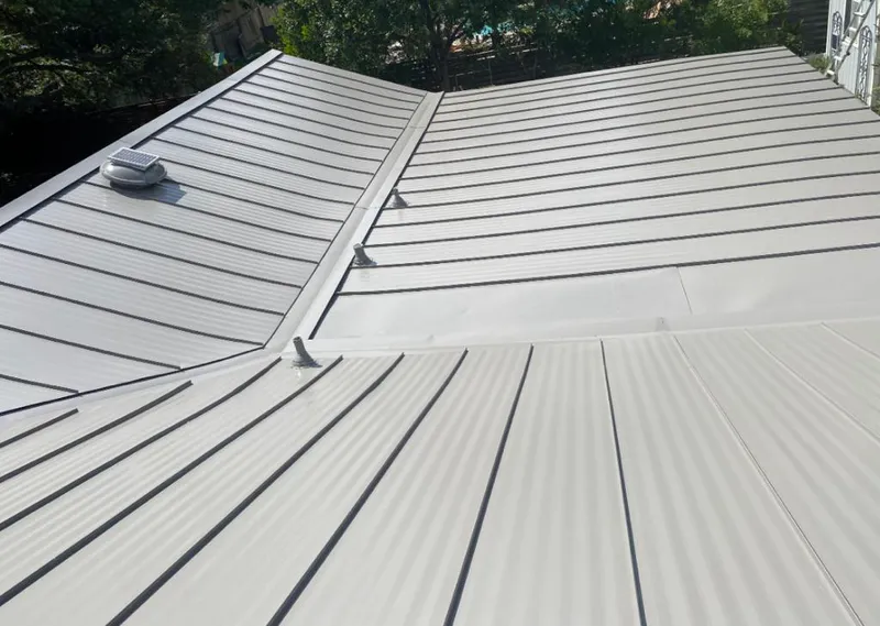 Solar attic fan installed on a metal roof for Roof Ventilation in Crooked River Ranch